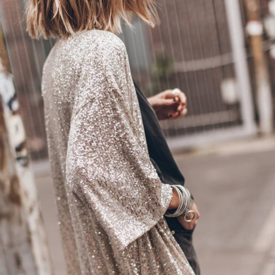 woman wearing sequins kimono in stone color