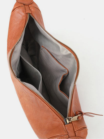 crossbody crescent bag in cognac interior view