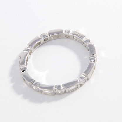 geometric ring in silver with baguette and round pattern zircon stones