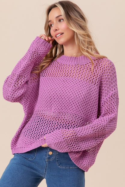 woman wearing purple knit sweater