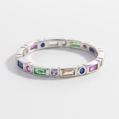 colorful eternity band in sterling silver with colored stones in baguette and rounds