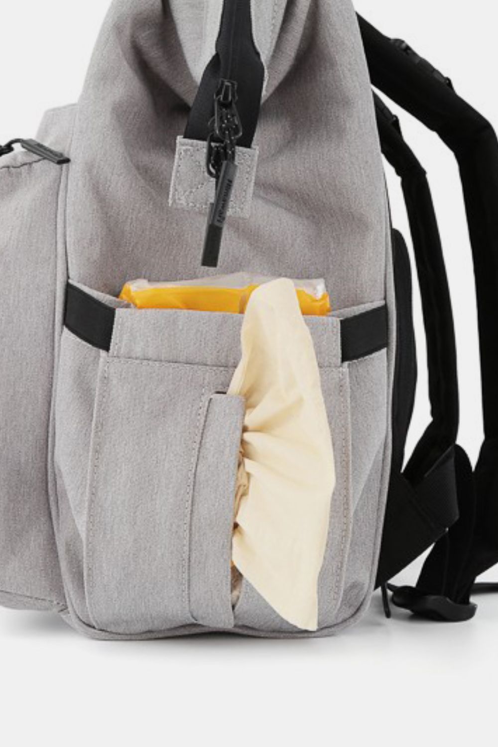 waterproof multi compartment backpack in gray side view