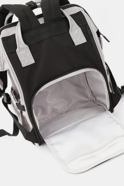 waterproof multi compartment backpack in gray view of back pocket