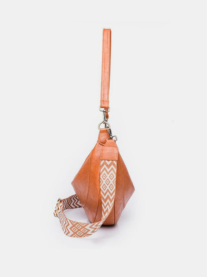 crossbody crescent bag in cognac side view