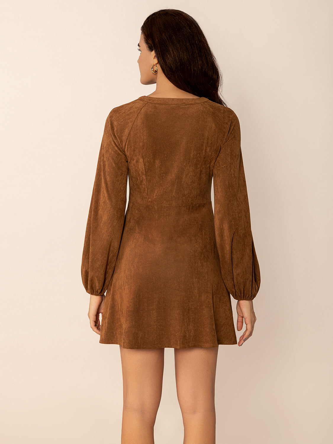 woman wearing faux suede mini dress in brown