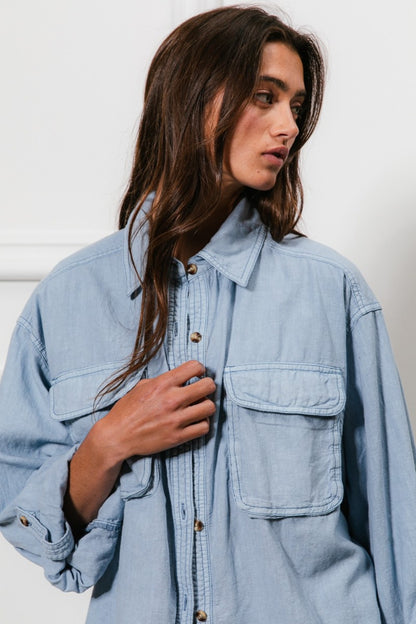 woman wearing relaxed fit denim shirt