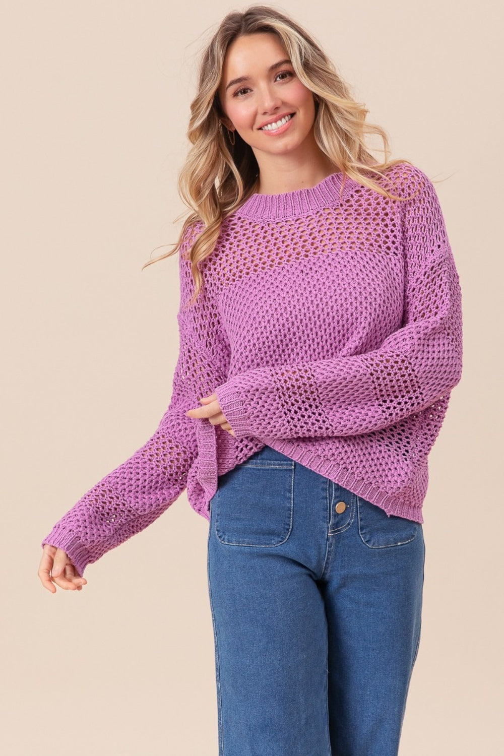 woman wearing purple knit sweater