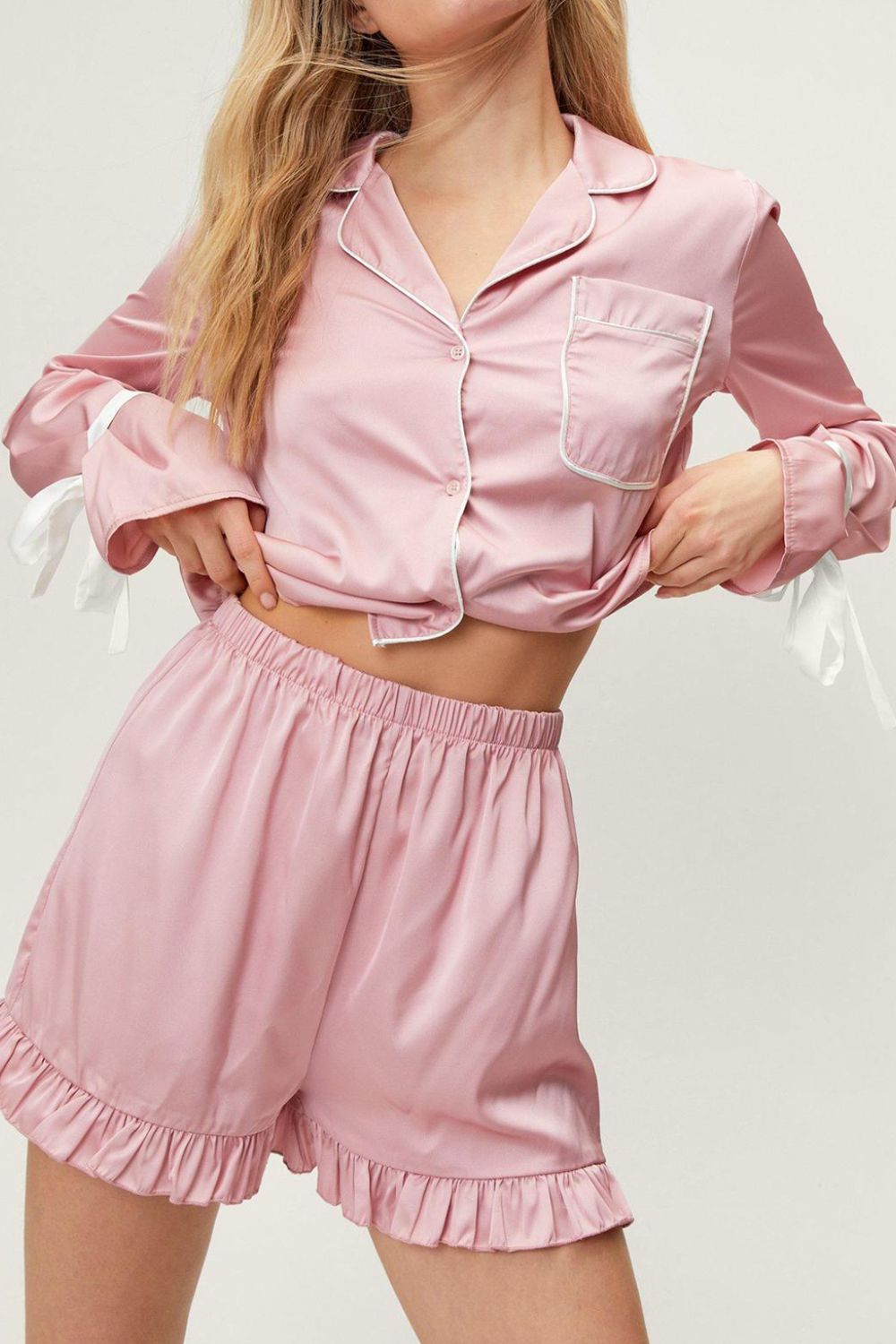 woman wearing silky lounge short set in pink