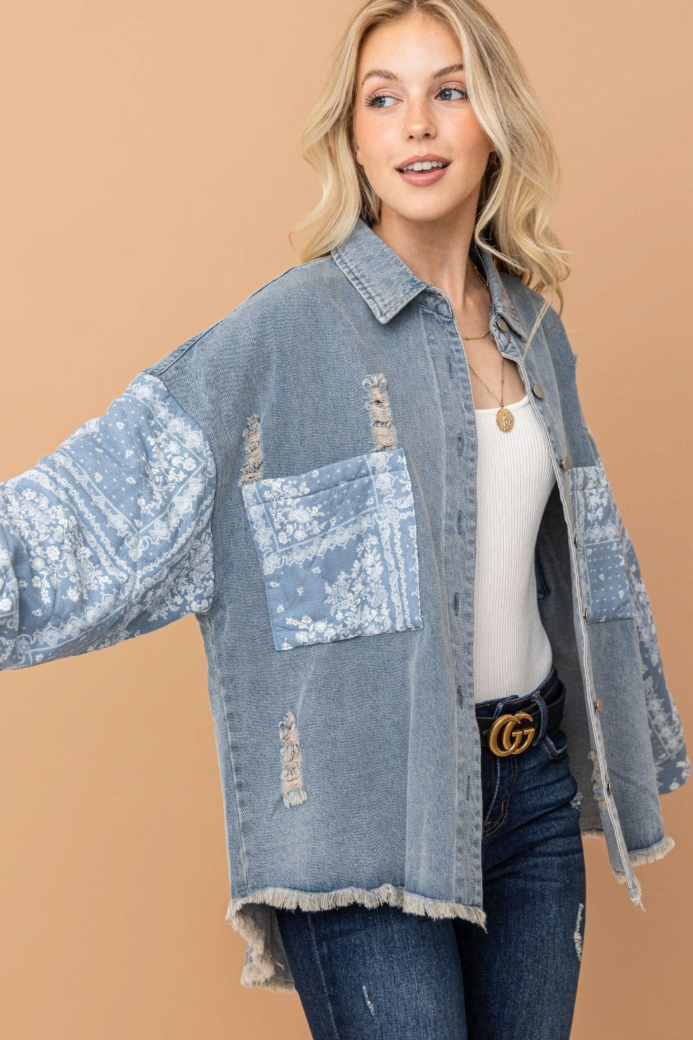 woman wearing high-low denim shacket with paisley pattern