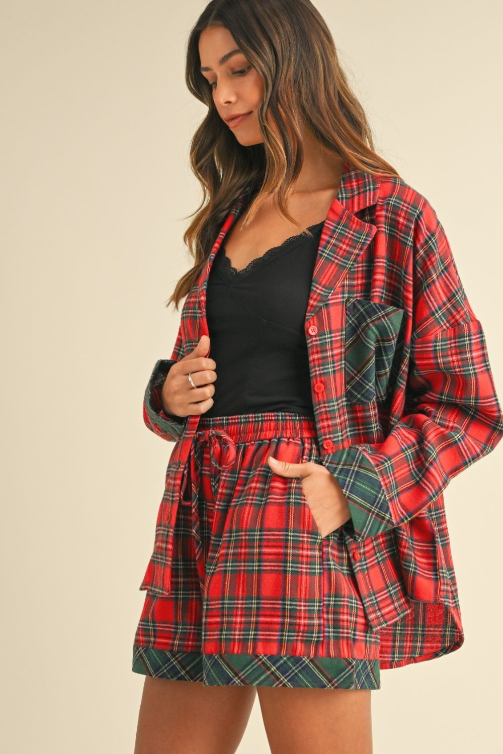 woman wearing red and green plaid lounge set