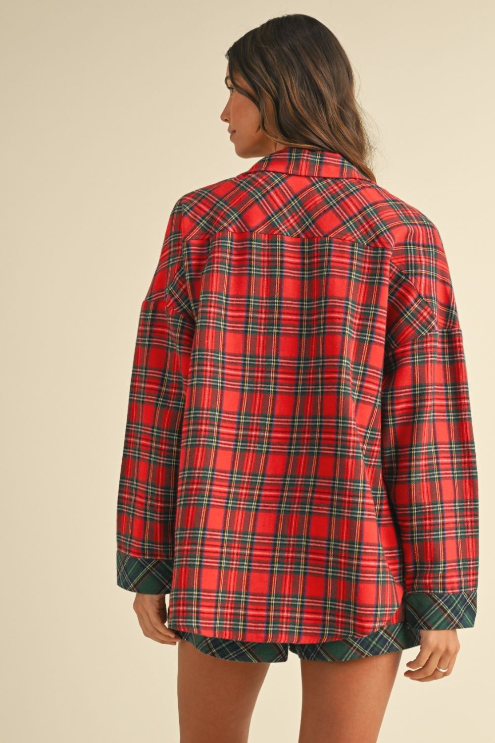 woman wearing red and green plaid lounge set