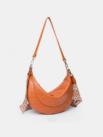 crossbody crescent bag in cognac side view