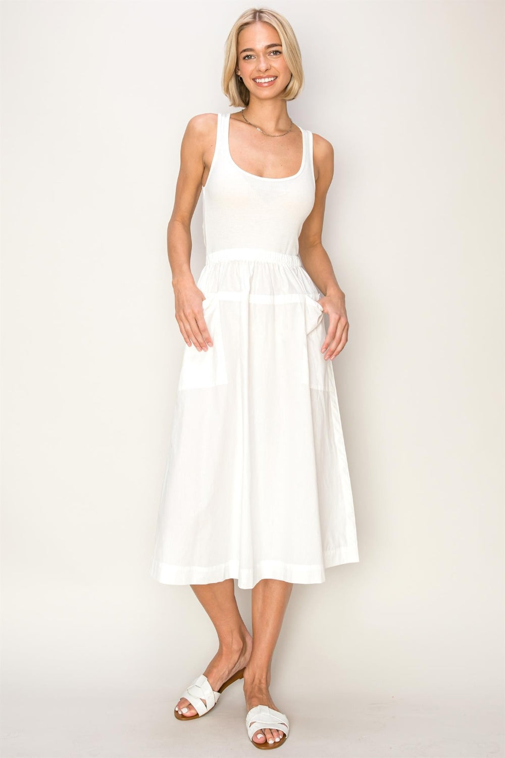 woman wearing white cotton midi tank top dress