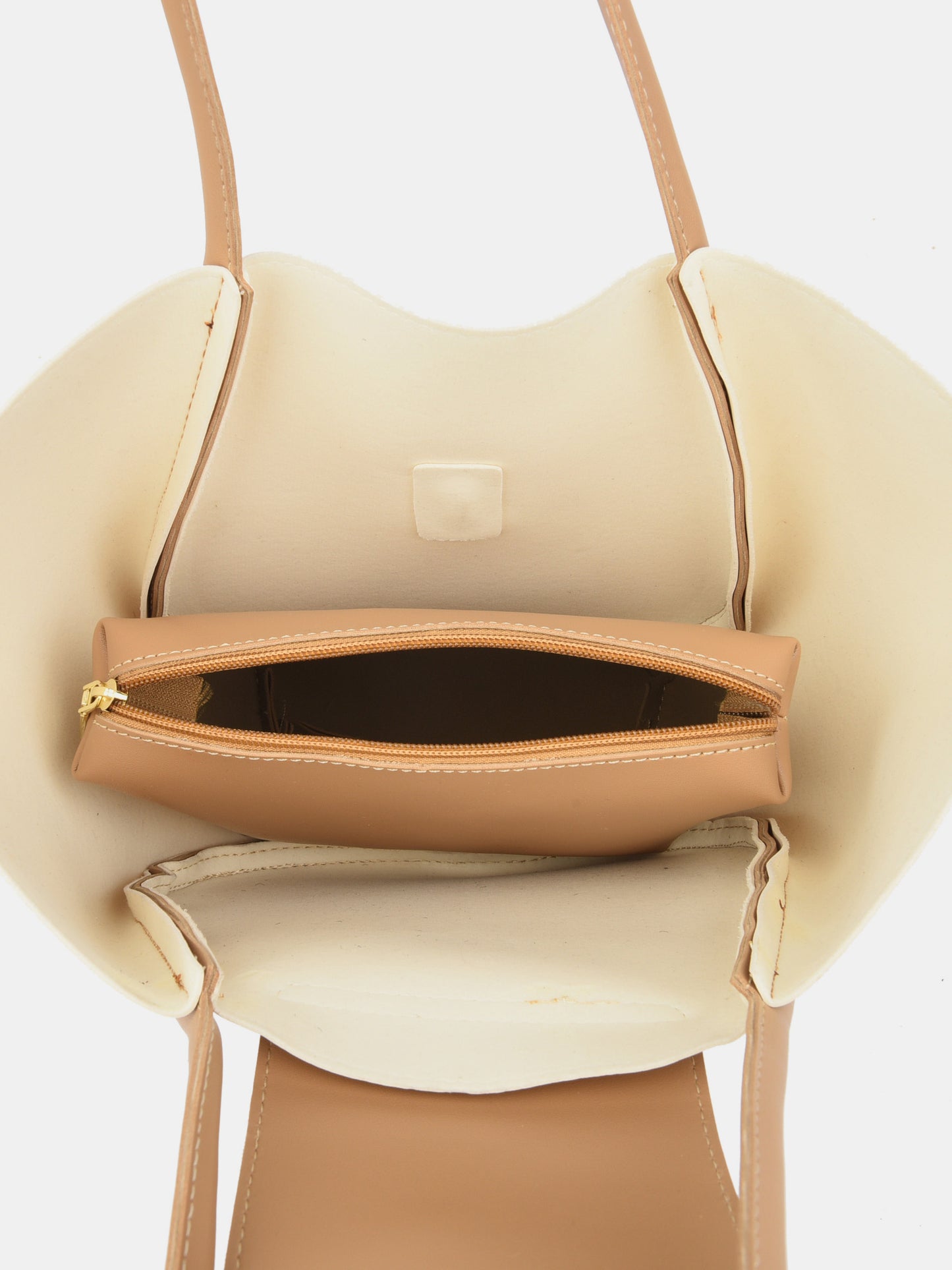 shoulder bag with removable pouch in cream and tan interior view