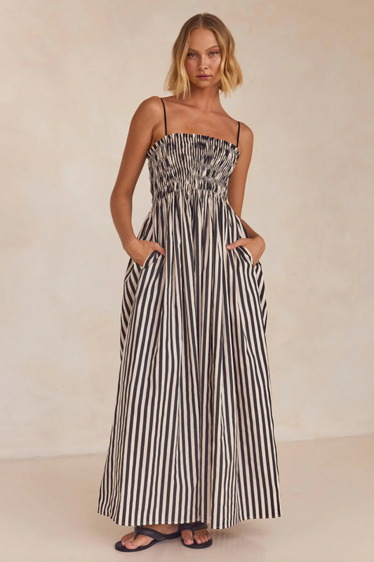 woman wearing striped maxi dress