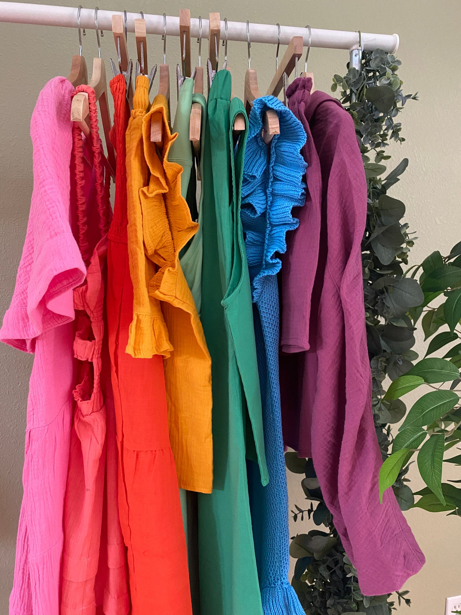 Clothing rack with cotton resort wear hung in a rainbow color order