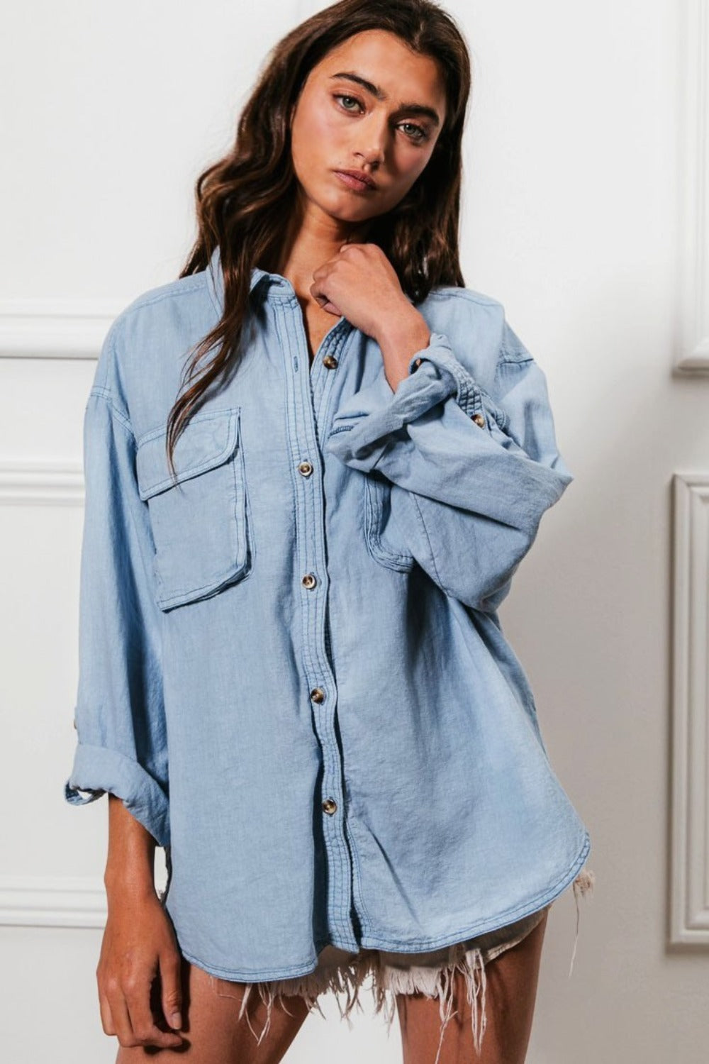 woman wearing relaxed fit denim shirt