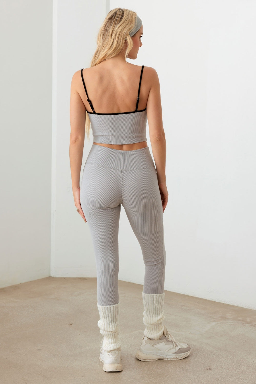 woman wearing gray activewear set back view