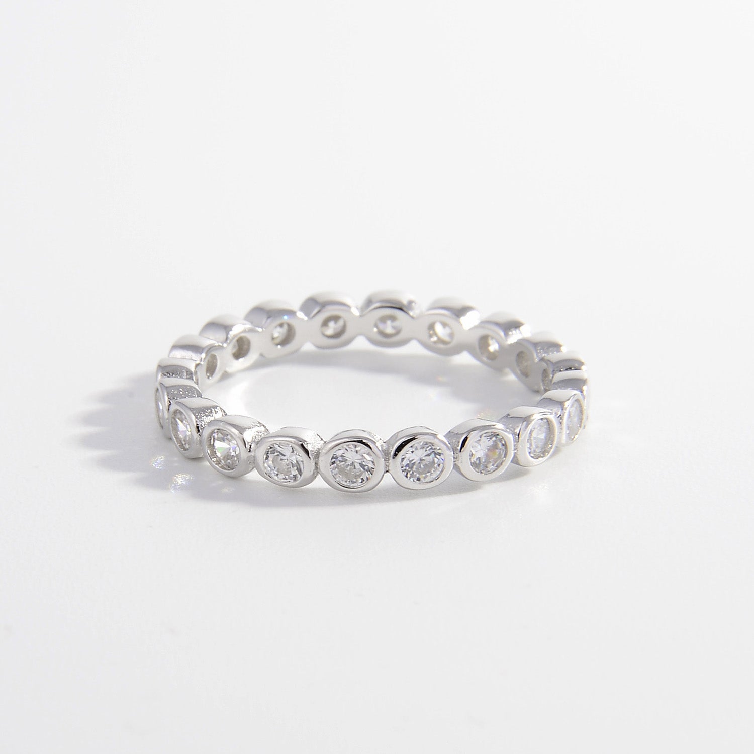 bezel set band with round stones in sterling silver