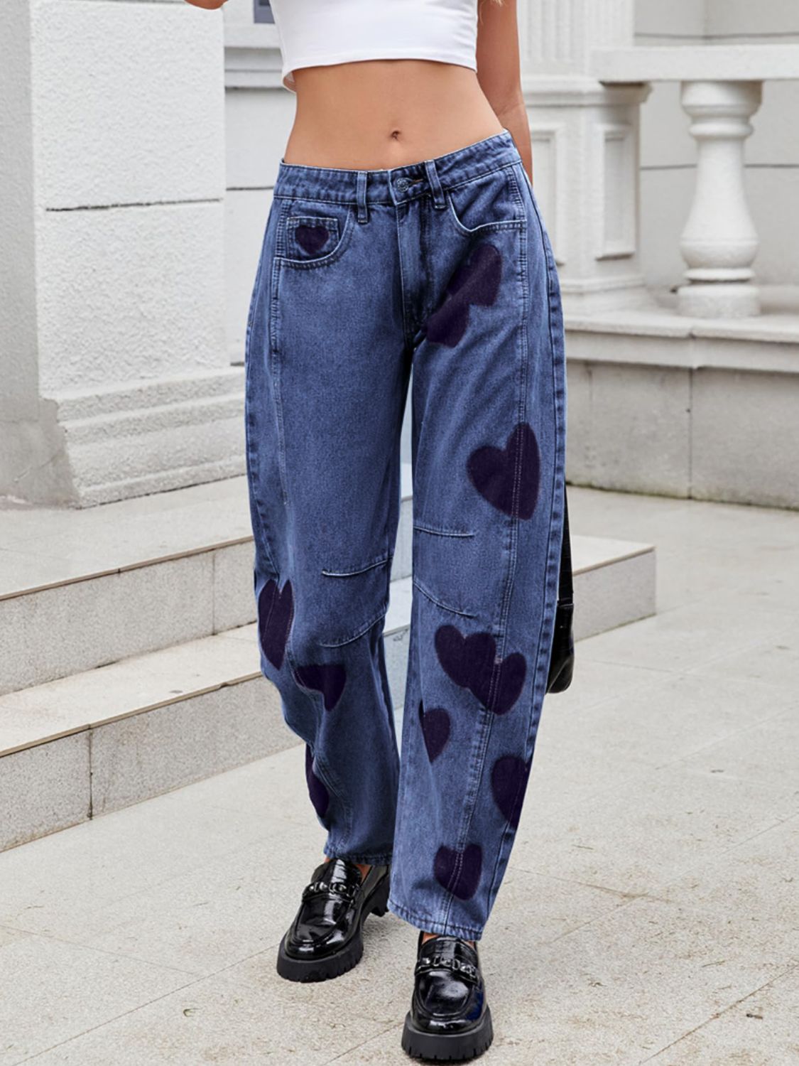 woman wearing mid rise jeans with hearts