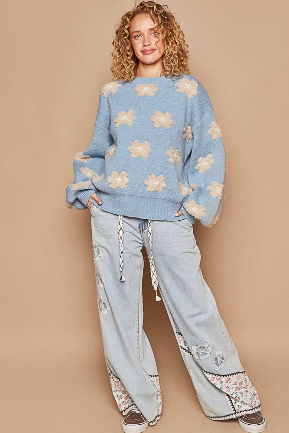 woman wearing cozy sweater in light blue