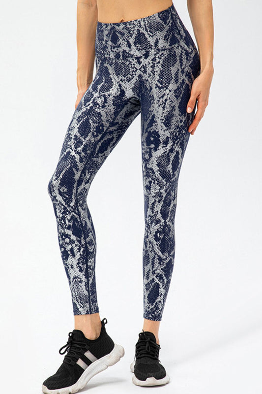 woman wearing snake print leggings in navy