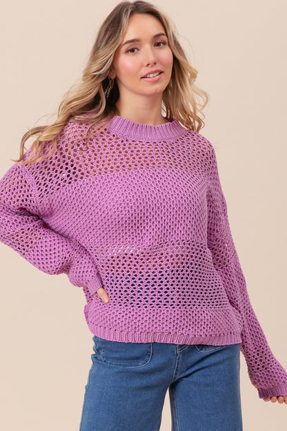 woman wearing purple knit sweater