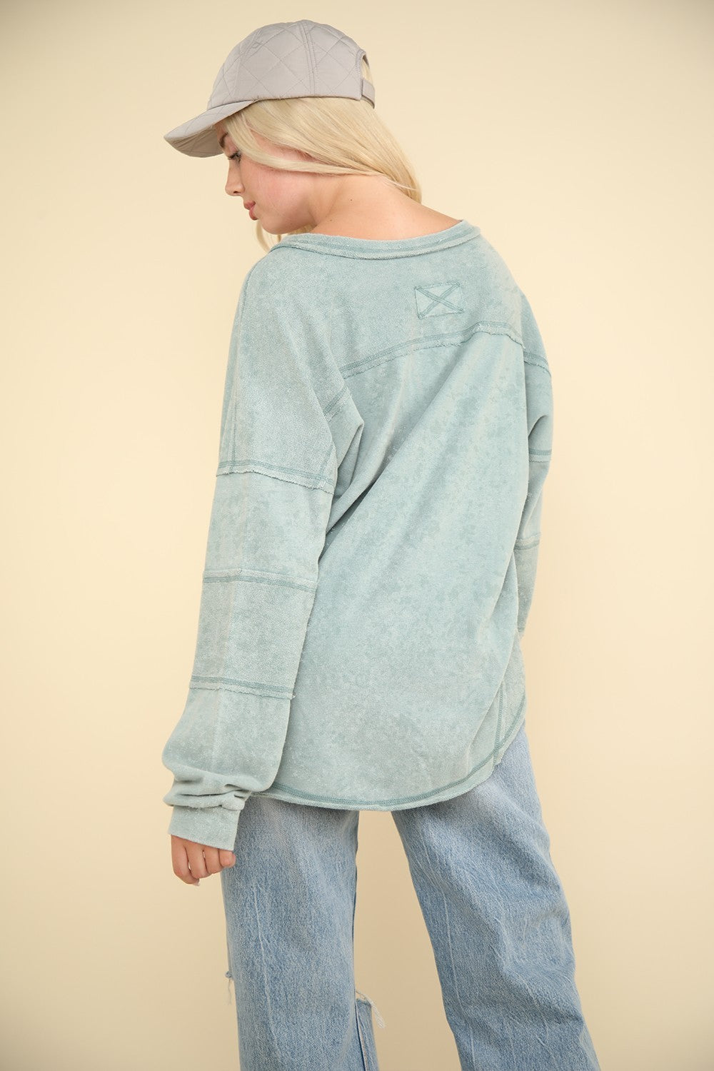 woman wearing long sleeve lounge top in peppermint green