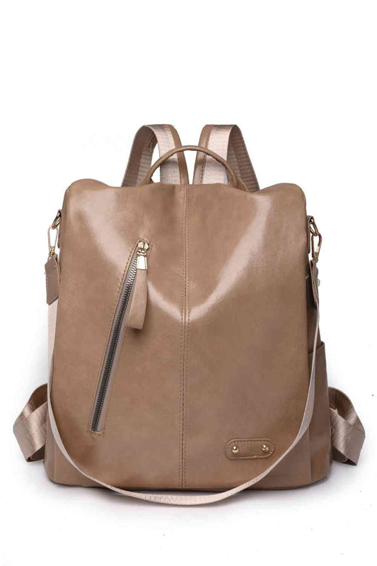 medium travel backpack in light brown front view